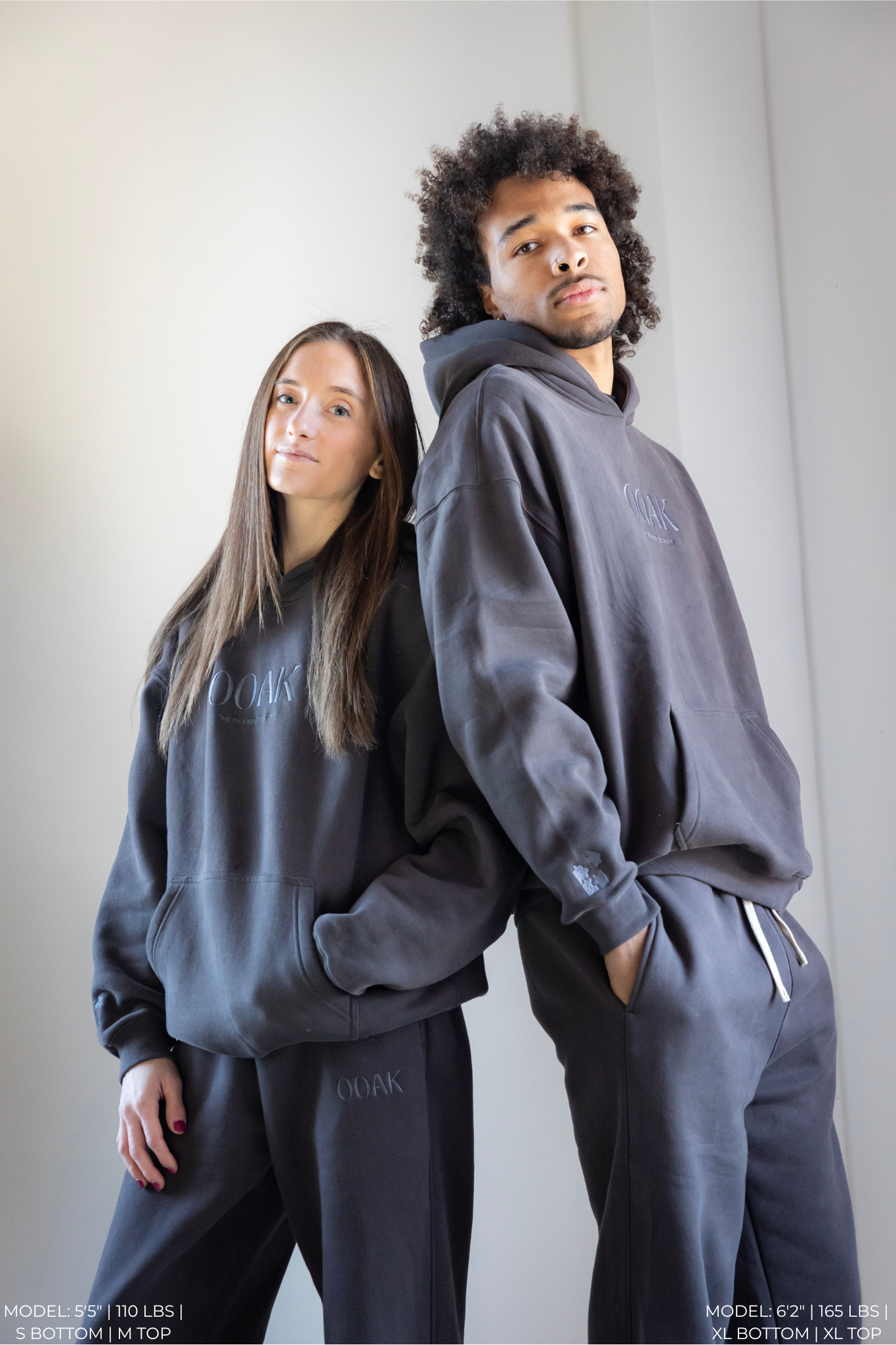 Two models wearing matching gray OOAK sets against a plain background.